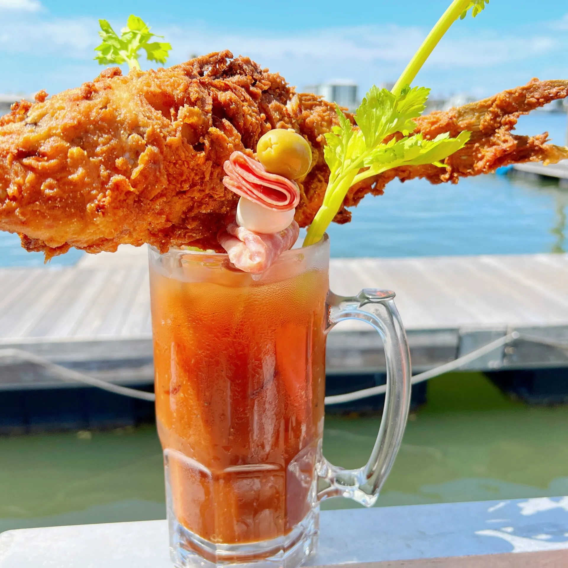 a glass of orange juice next to a cup of water